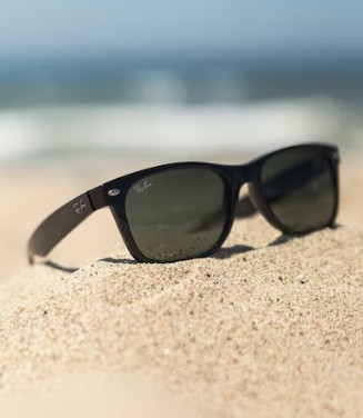 Sunglasses in the sand at a beach